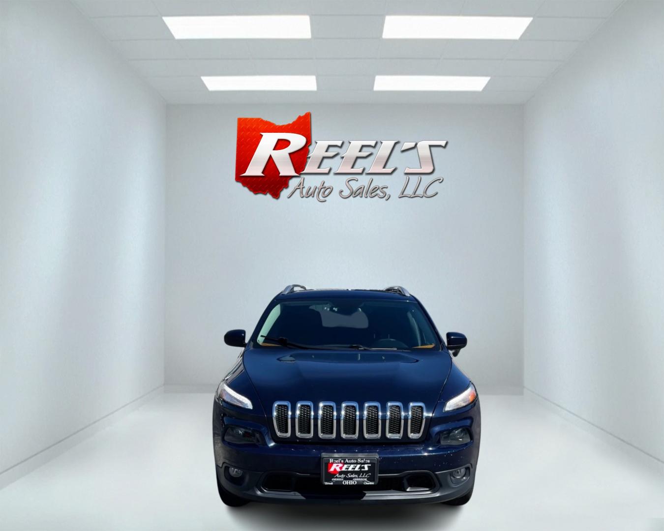 2016 Blue /Black Jeep Cherokee Latitude 4WD (1C4PJMCS1GW) with an 3.2L V6 DOHC 24V engine, 9-Speed Automatic transmission, located at 11115 Chardon Rd. , Chardon, OH, 44024, (440) 214-9705, 41.580246, -81.241943 - Photo#1